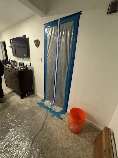 Plastic containment doorway with a zipper set up for drying in Walnut Creek, CA