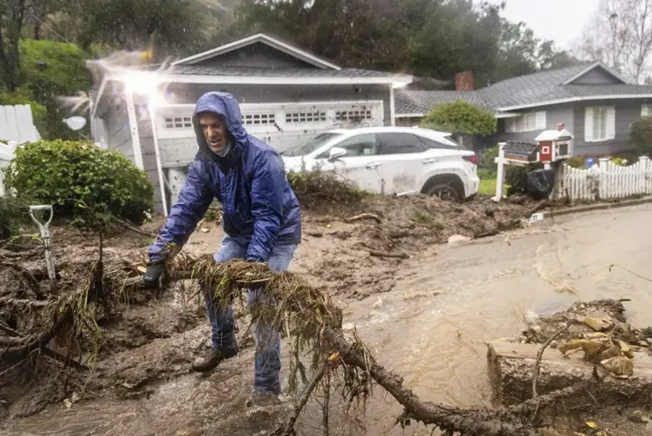 Storm mud and debris washed across a driveway in Walnut Creek, CA
